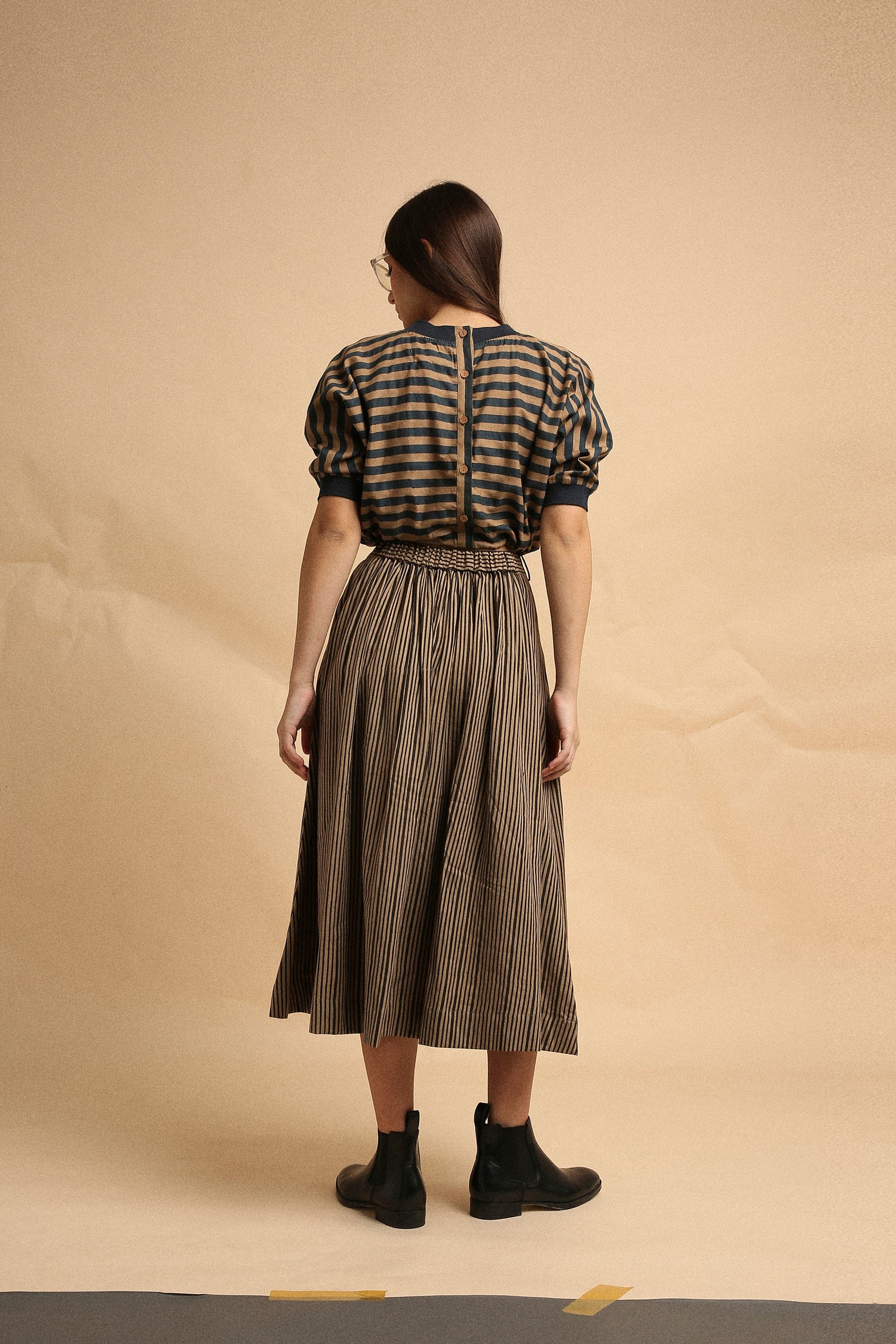 Handspun cotton box pleat skirt in brown with narrow charcoal stripes, back elastic and side zipper, by MATI India
