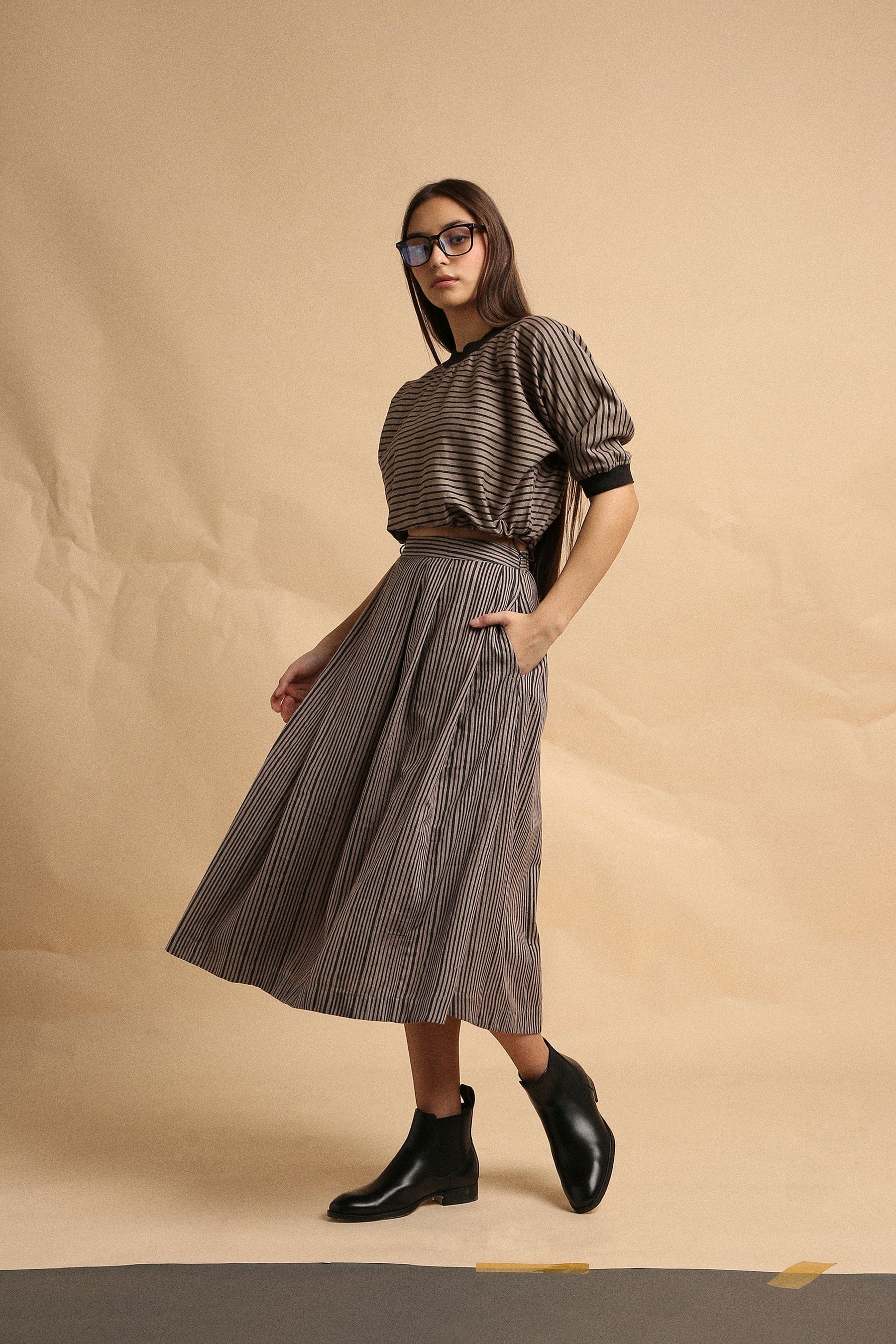 Handspun cotton box pleat skirt in grey with narrow charcoal stripes, back elastic and side zipper, by MATI India