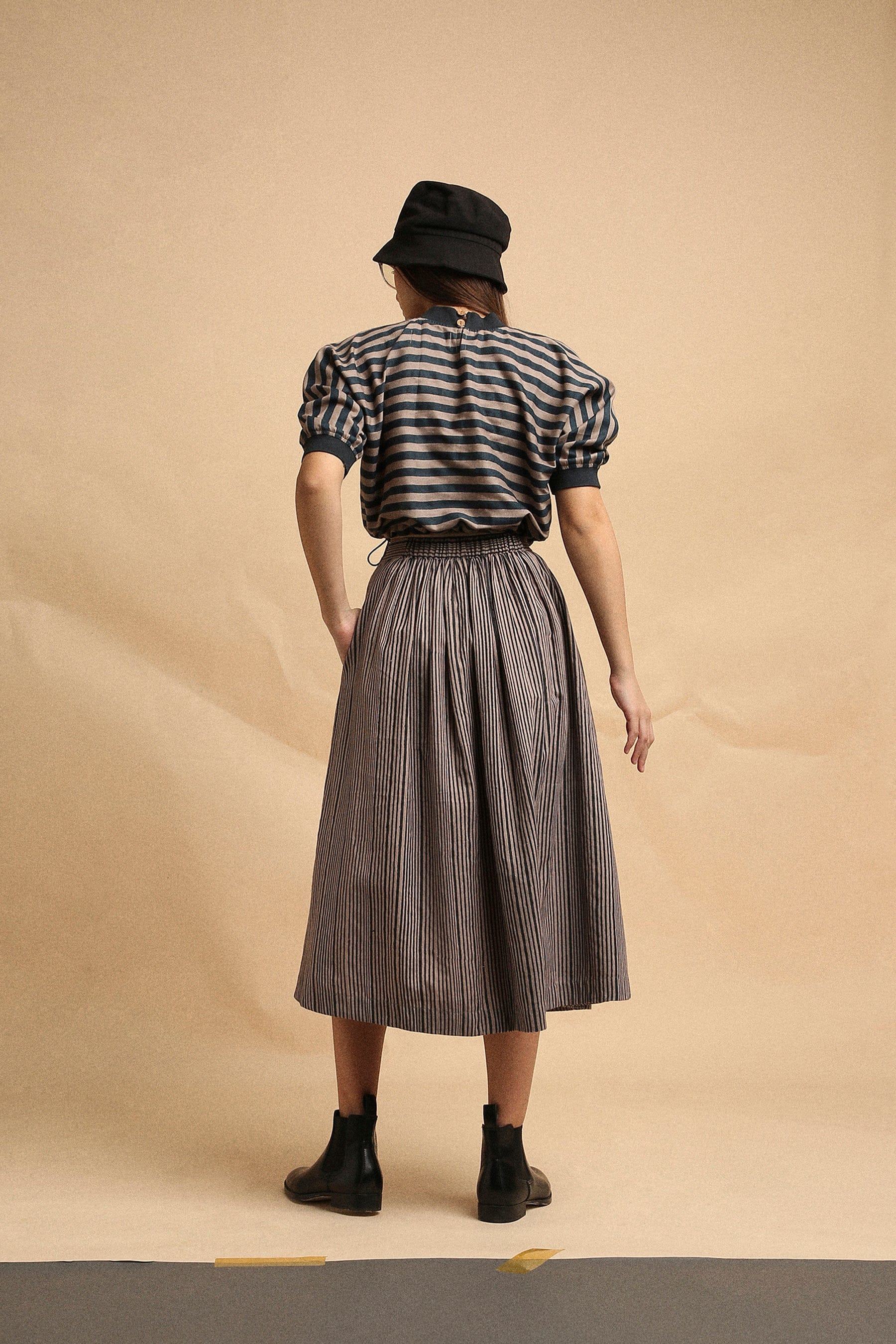 Handspun cotton box pleat skirt in grey with narrow charcoal stripes, back elastic and side zipper, by MATI India