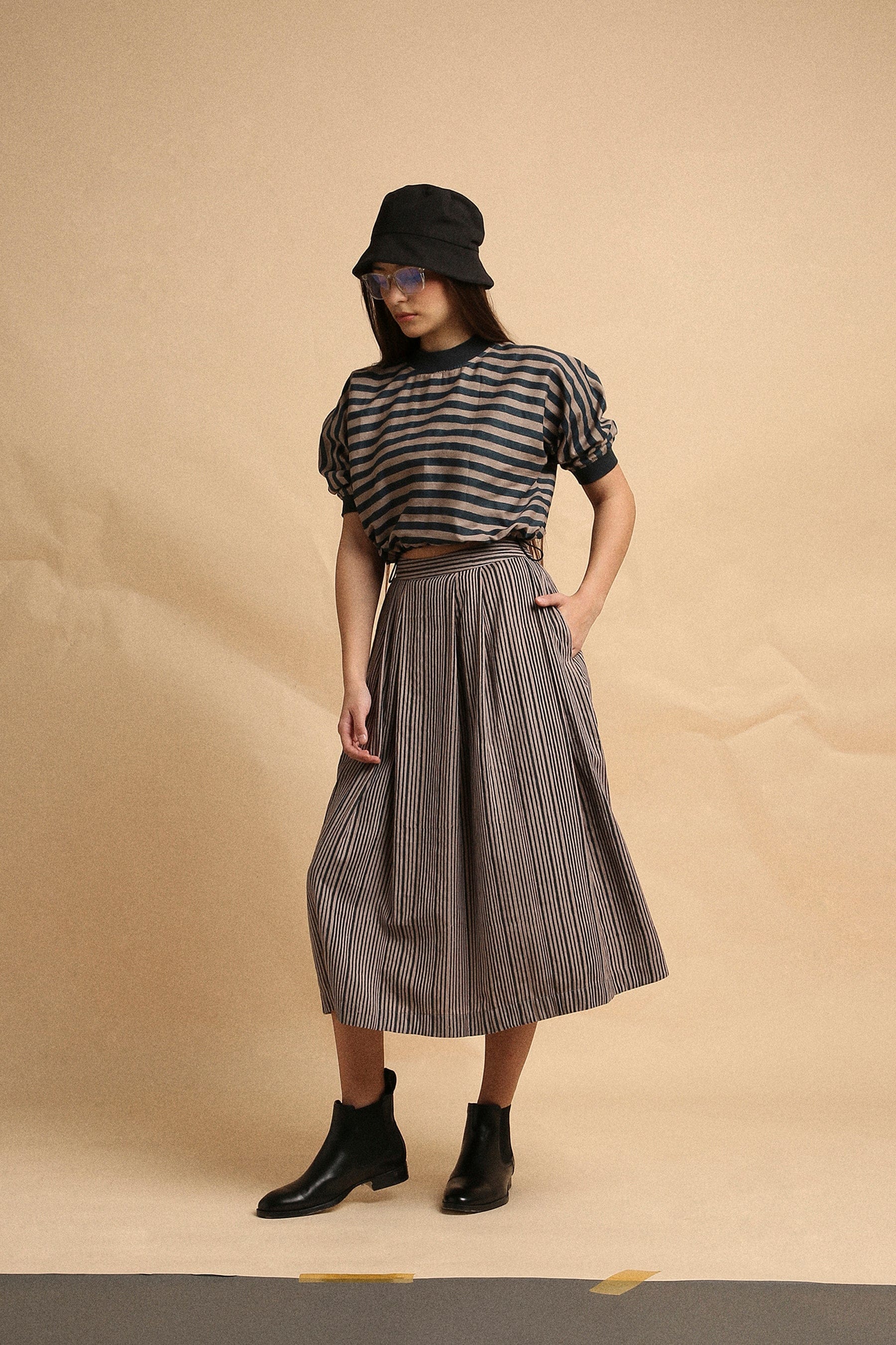 Handspun cotton box pleat skirt in grey with narrow charcoal stripes, back elastic and side zipper, by MATI India