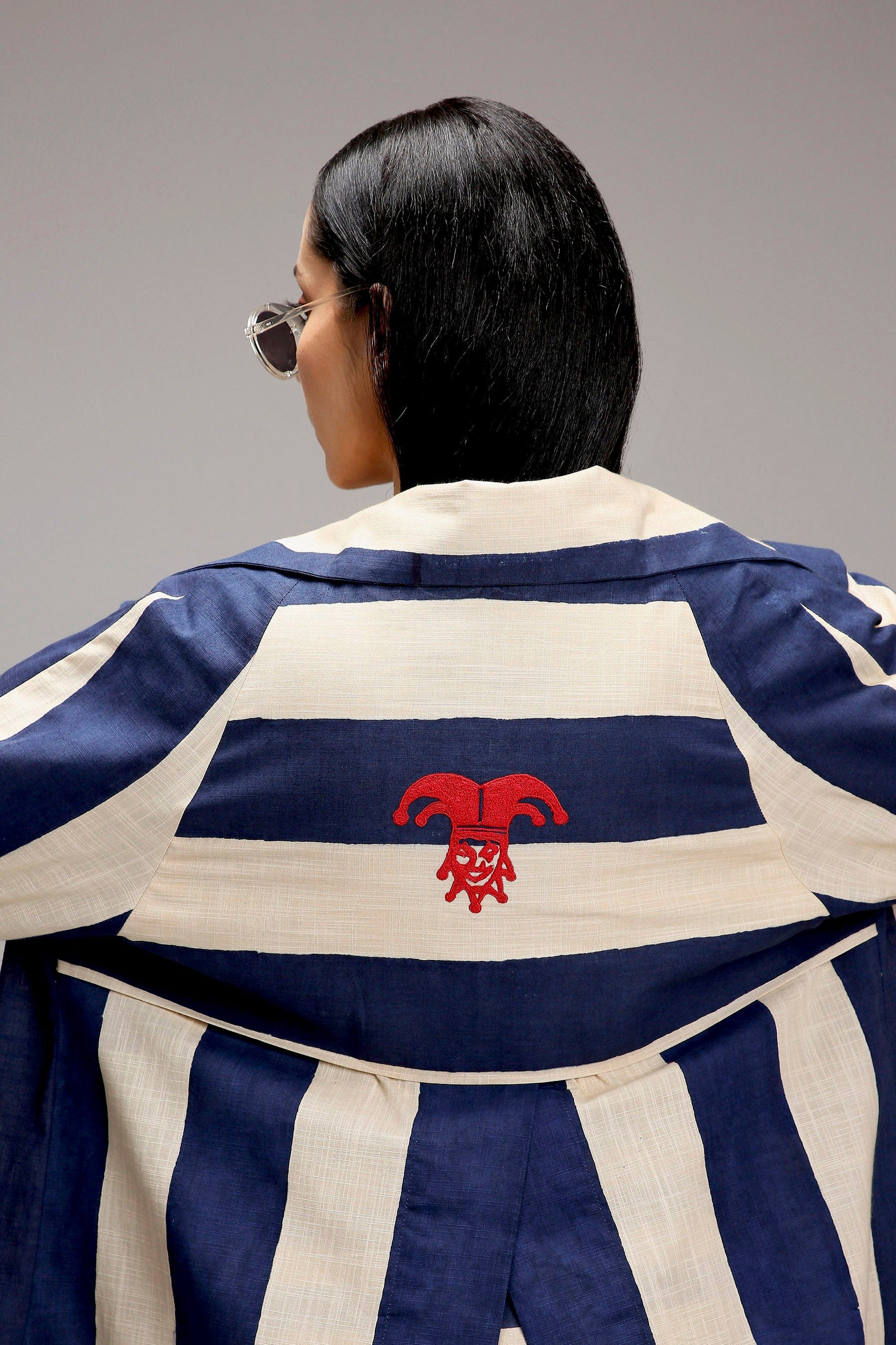 MATI egg-shell big striped trench jacket – back view with joker embroidery detail