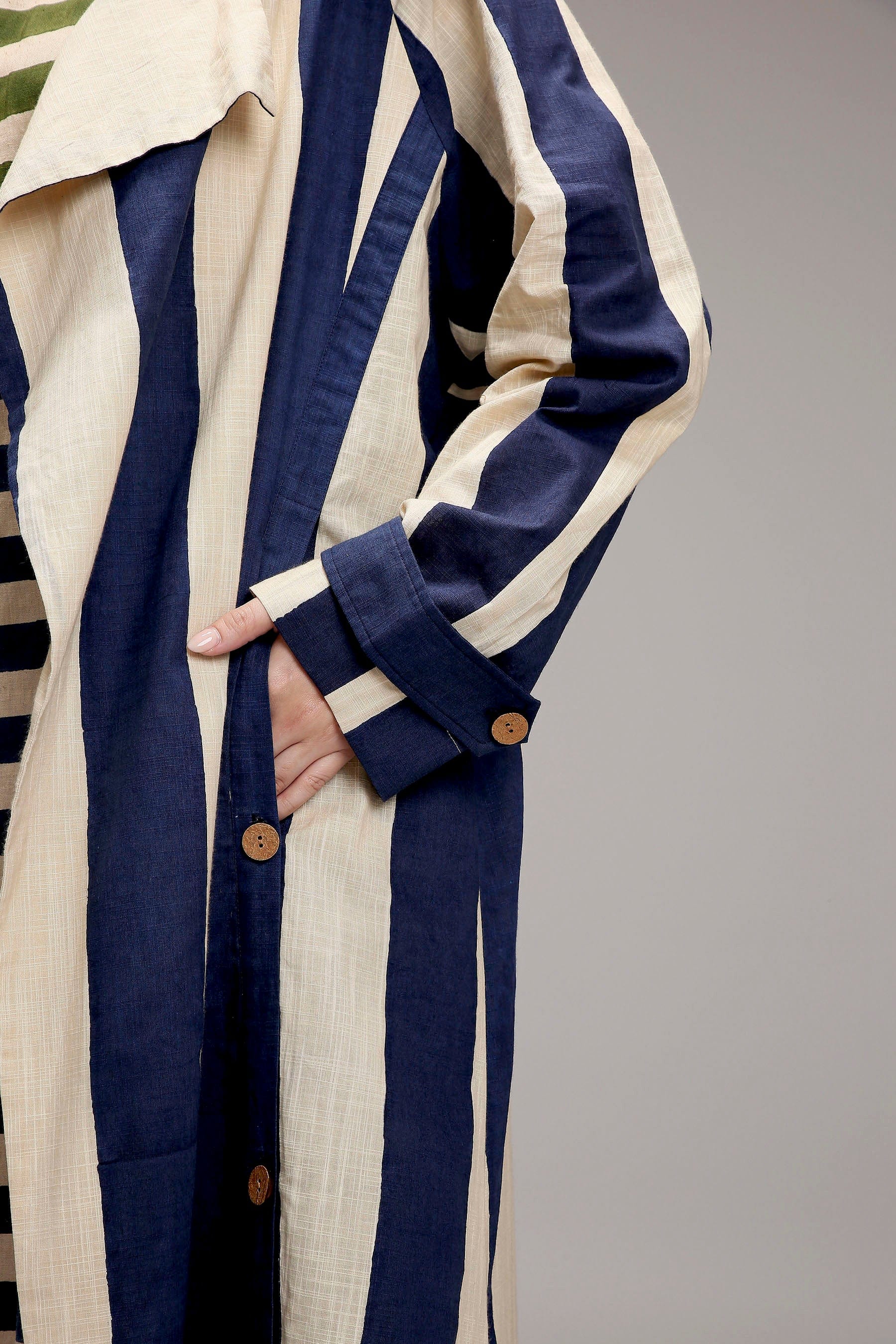 Handwoven cotton stripe detail on MATI egg-shell trench jacket