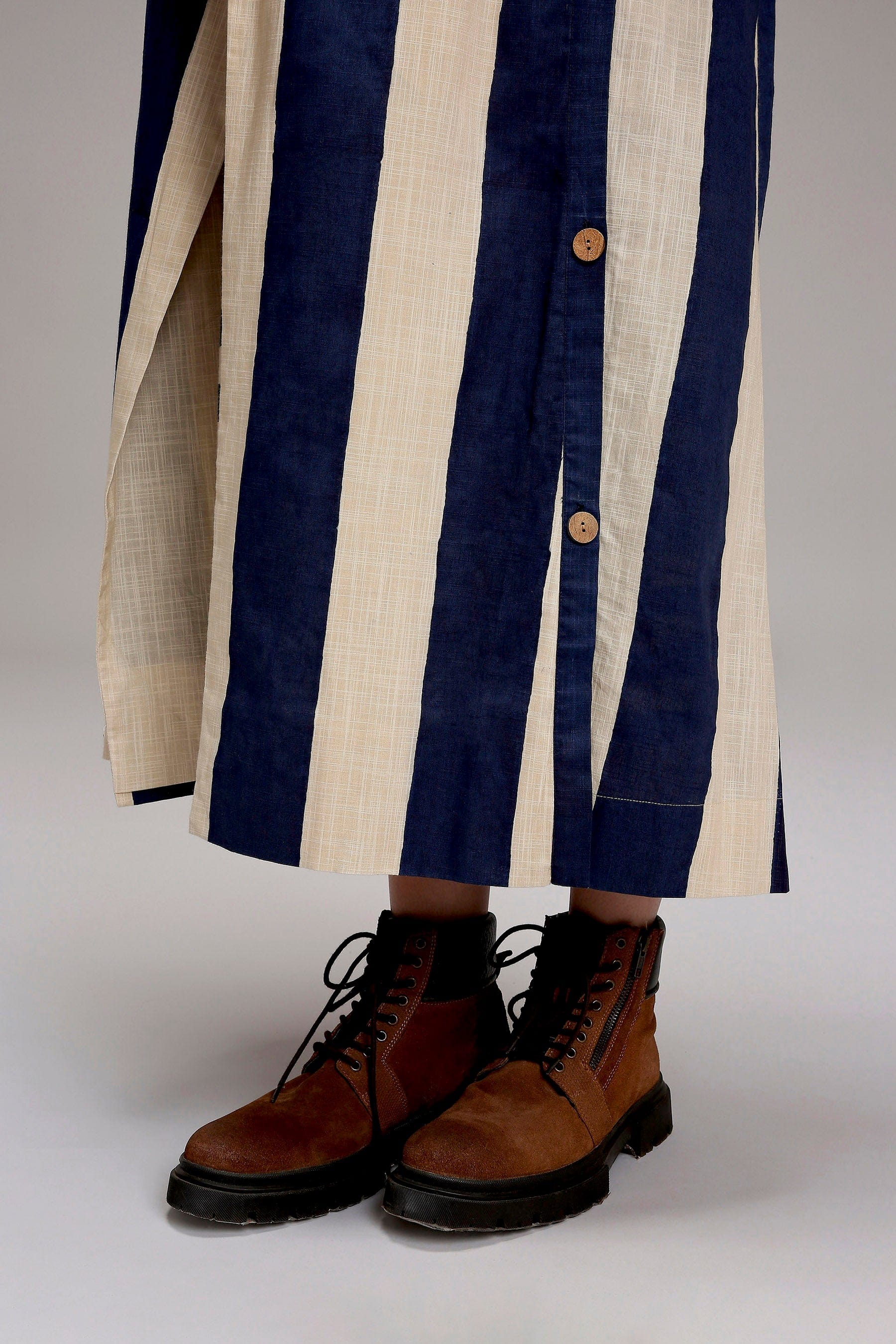 Handwoven cotton length detail on MATI egg-shell striped trench jacket