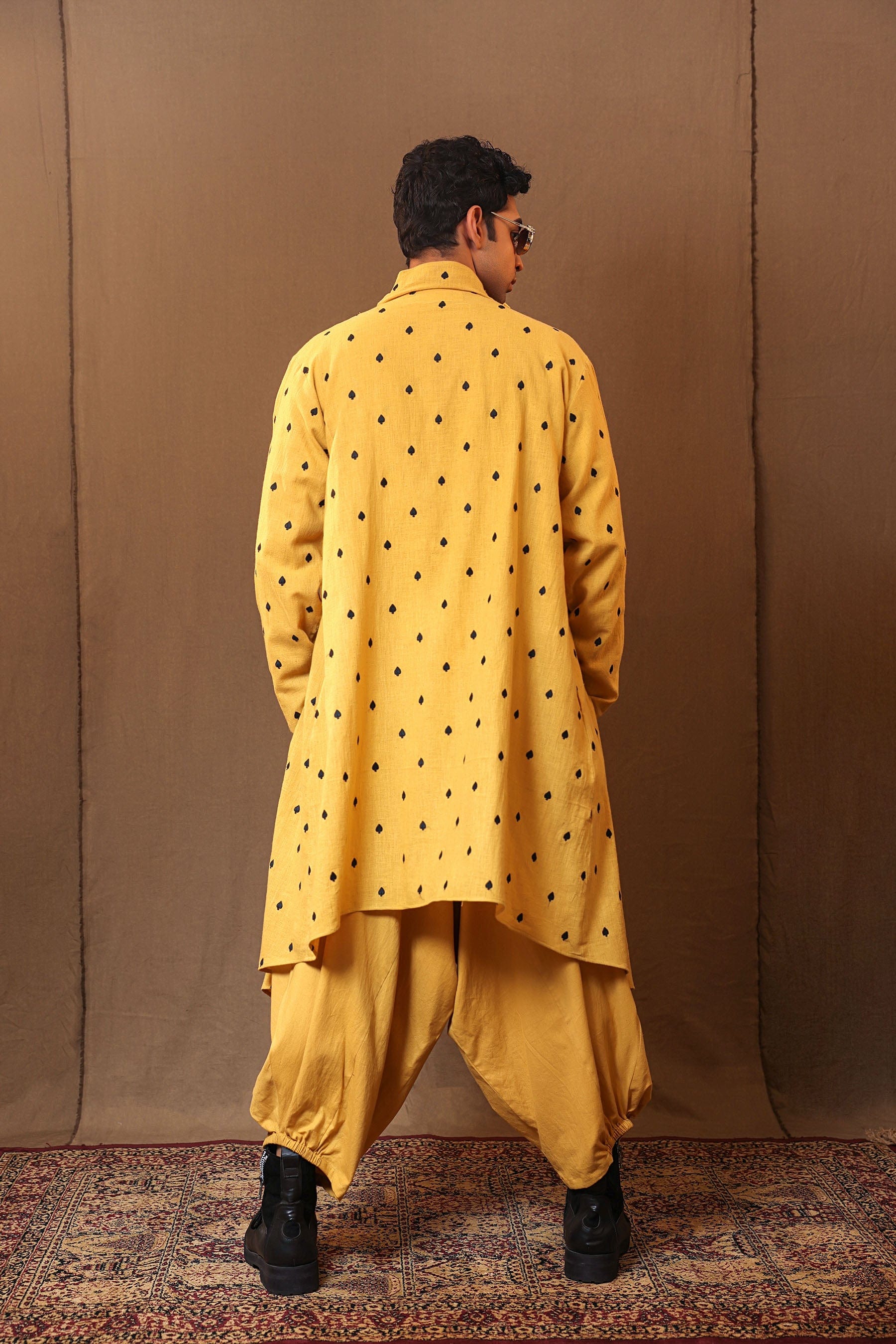 Styled back view of mustard 3-piece embroidered cotton set by MATI