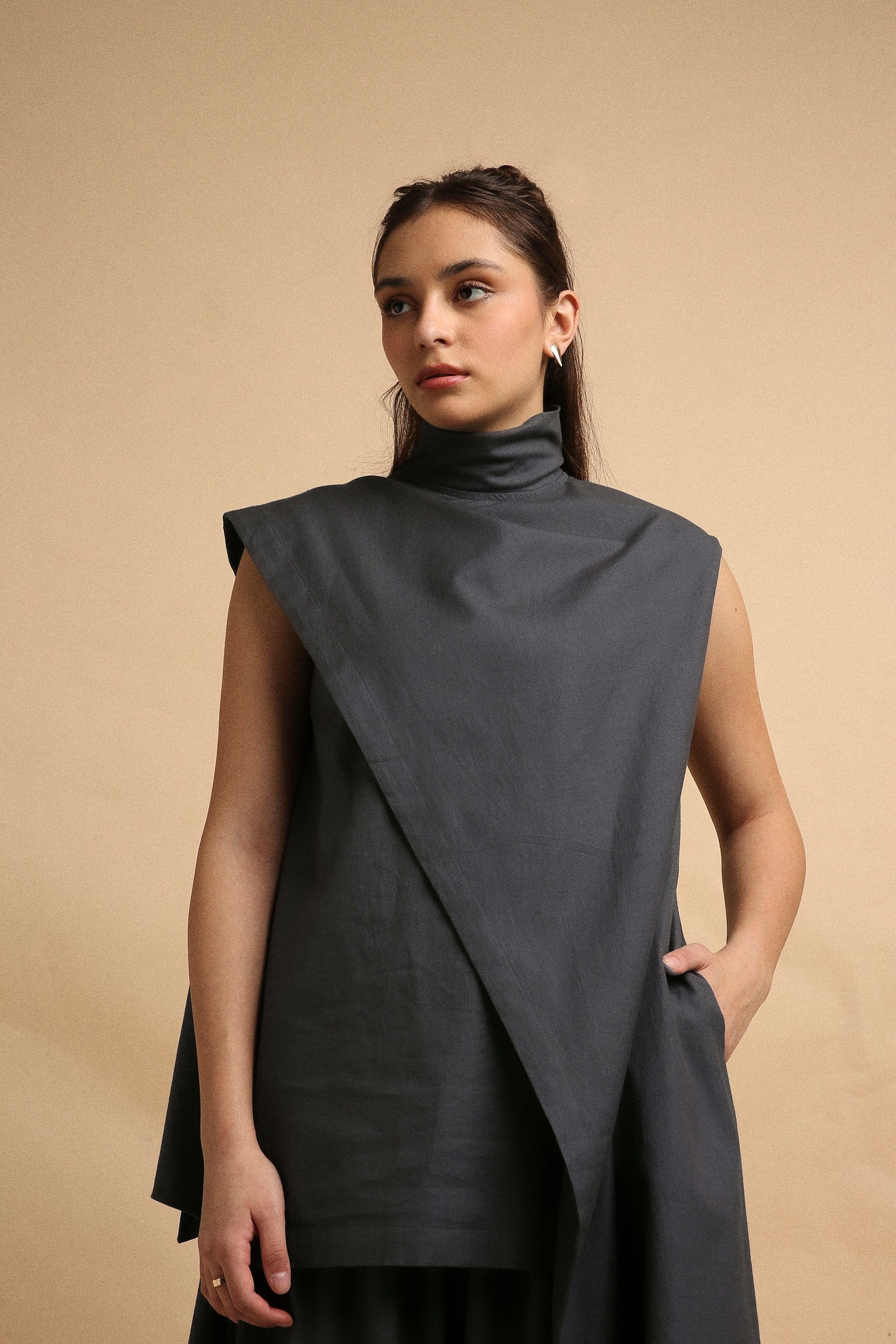 Handwoven cotton Toga tunic and pleated pants co-ord set in ash grey with high-low hem and turtle neck, by MATI India
