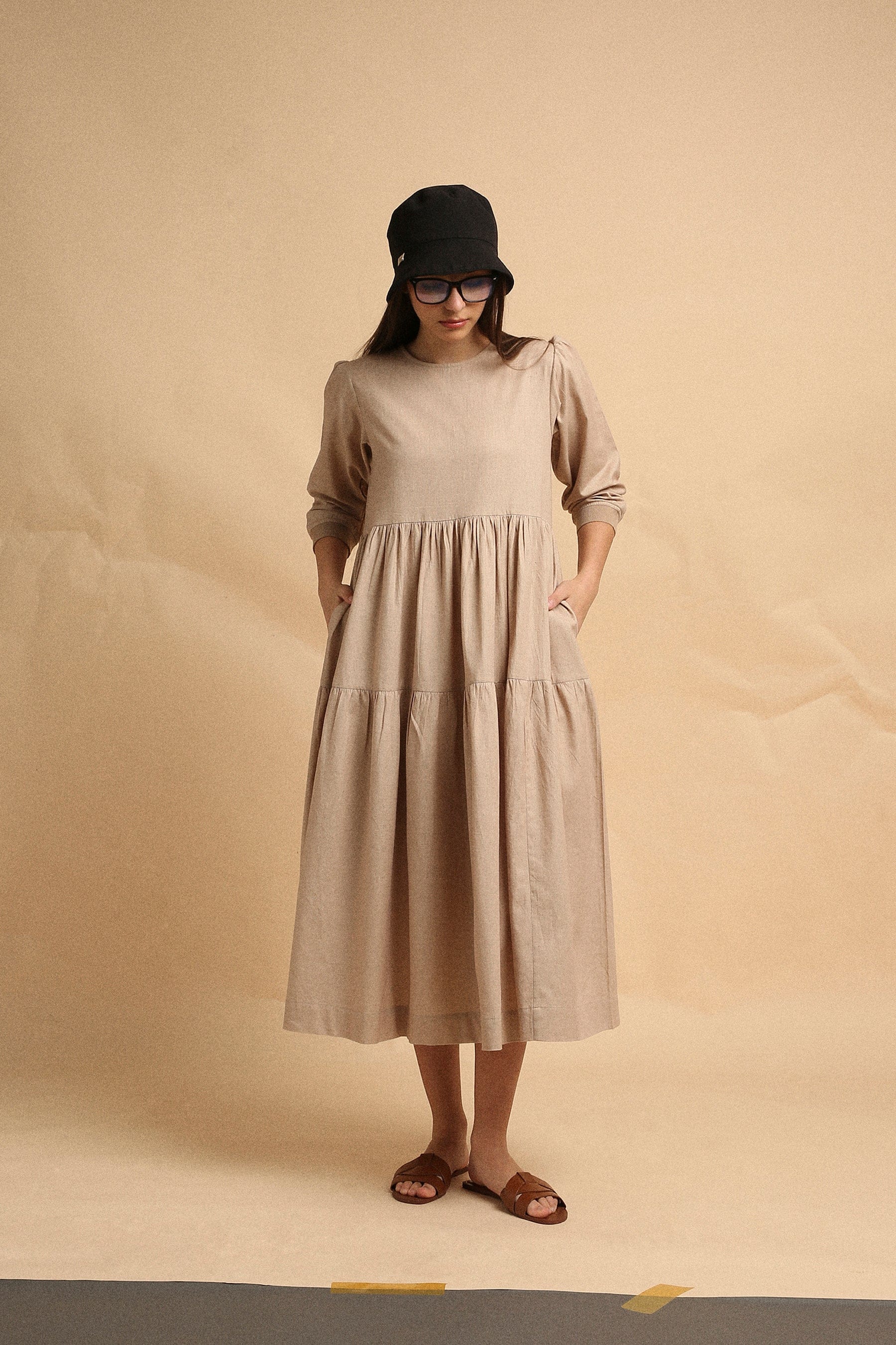 Handspun cotton tiered Vasara rib dress in sand with side pockets and wooden button opening, by MATI India