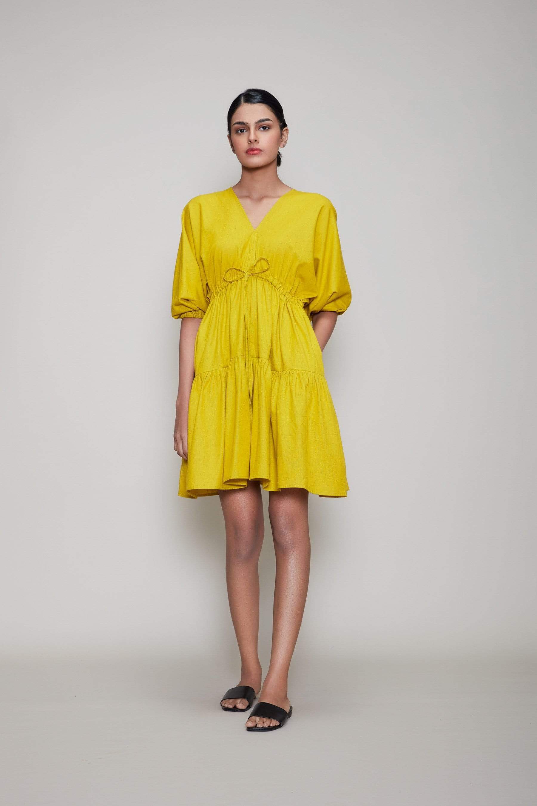 Handwoven cotton short tiered dress in yellow with Azo-free dye, side pockets and drawstring waist, by MATI India