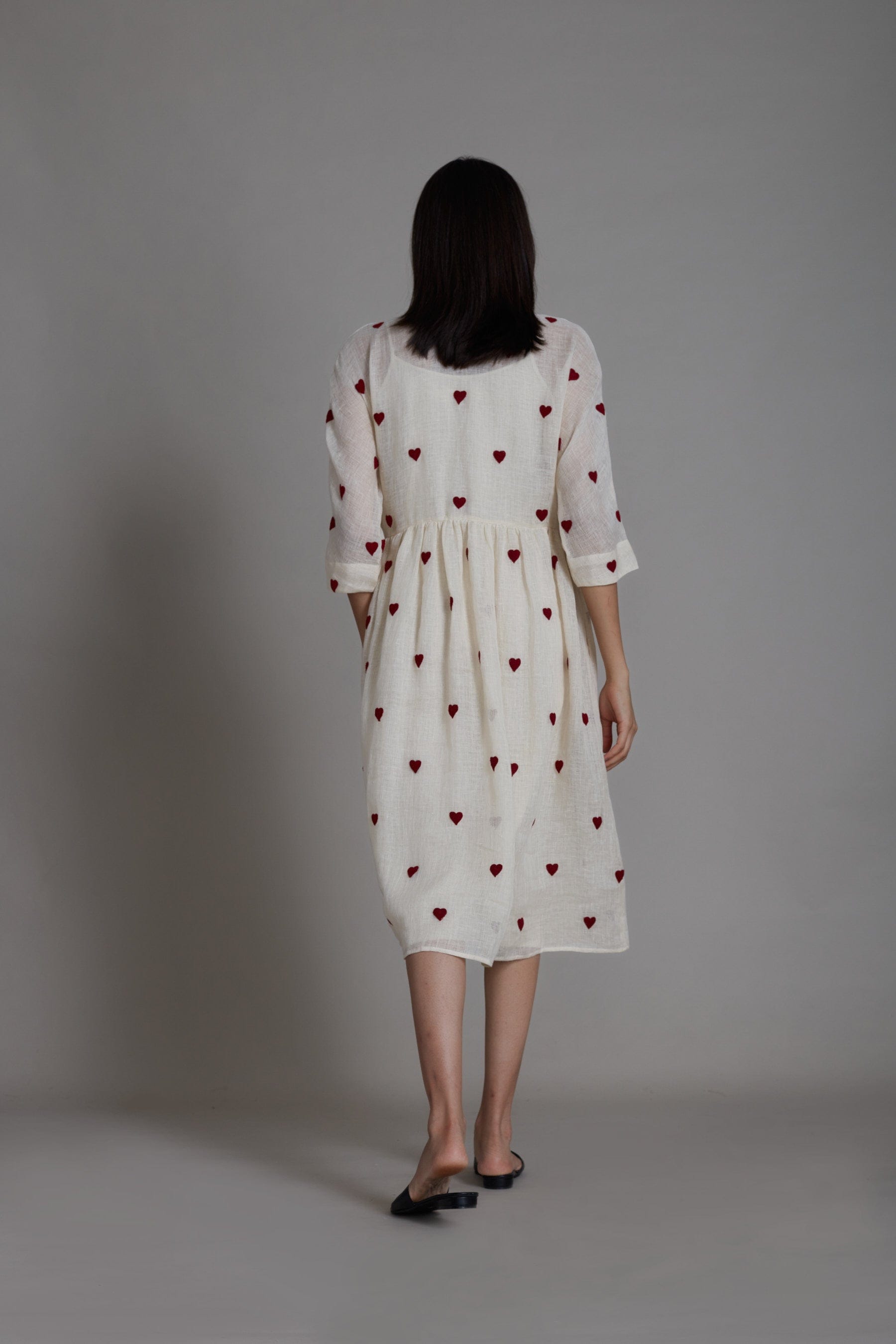 Handwoven pure linen Teen Patti dress in oatmeal with heart thread embroidery and extended sleeves, by MATI India