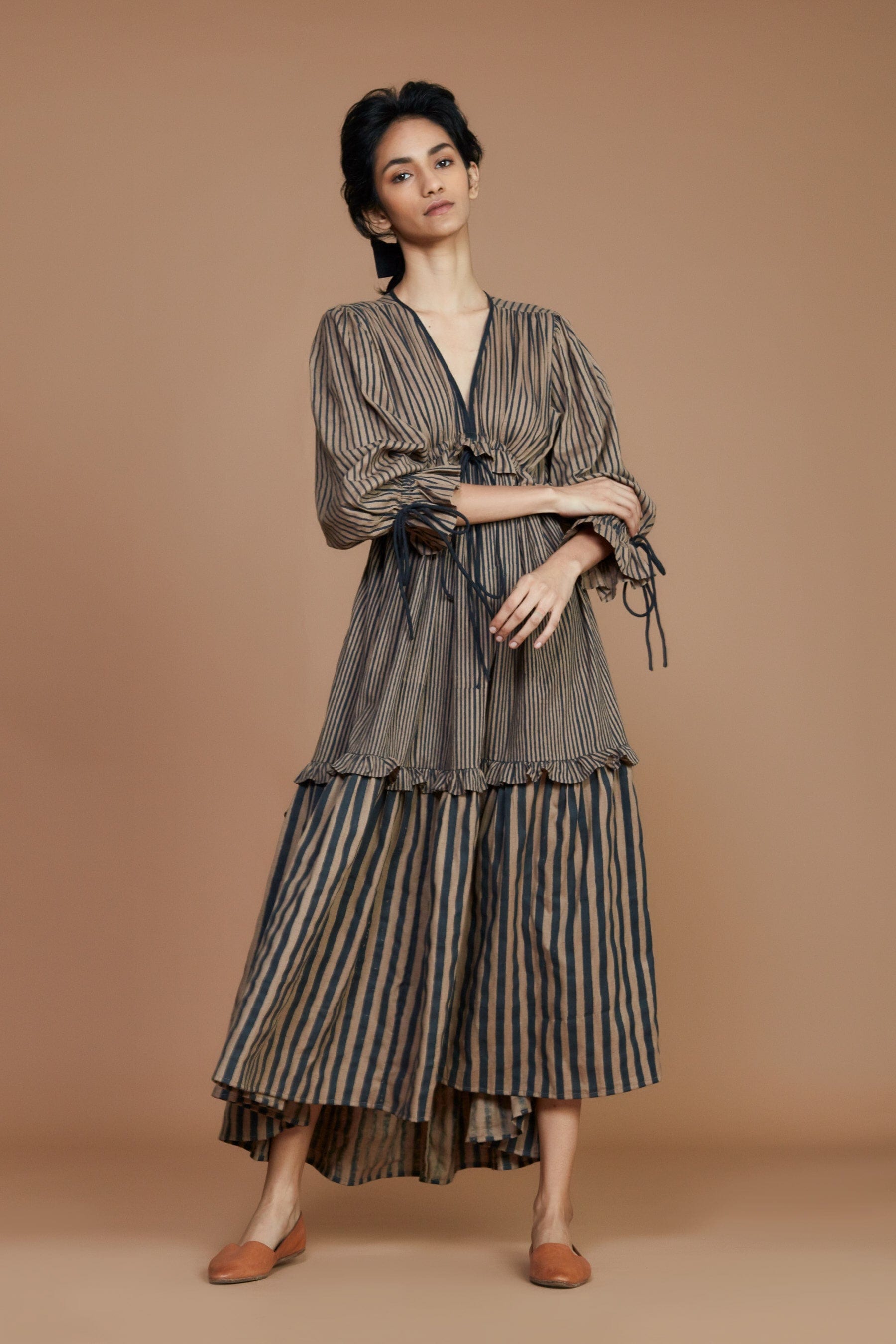 Handwoven cotton striped tiered frill dress in brown with charcoal stripes, Azo-free dye, blouson sleeves and drawstring waist, by MATI India