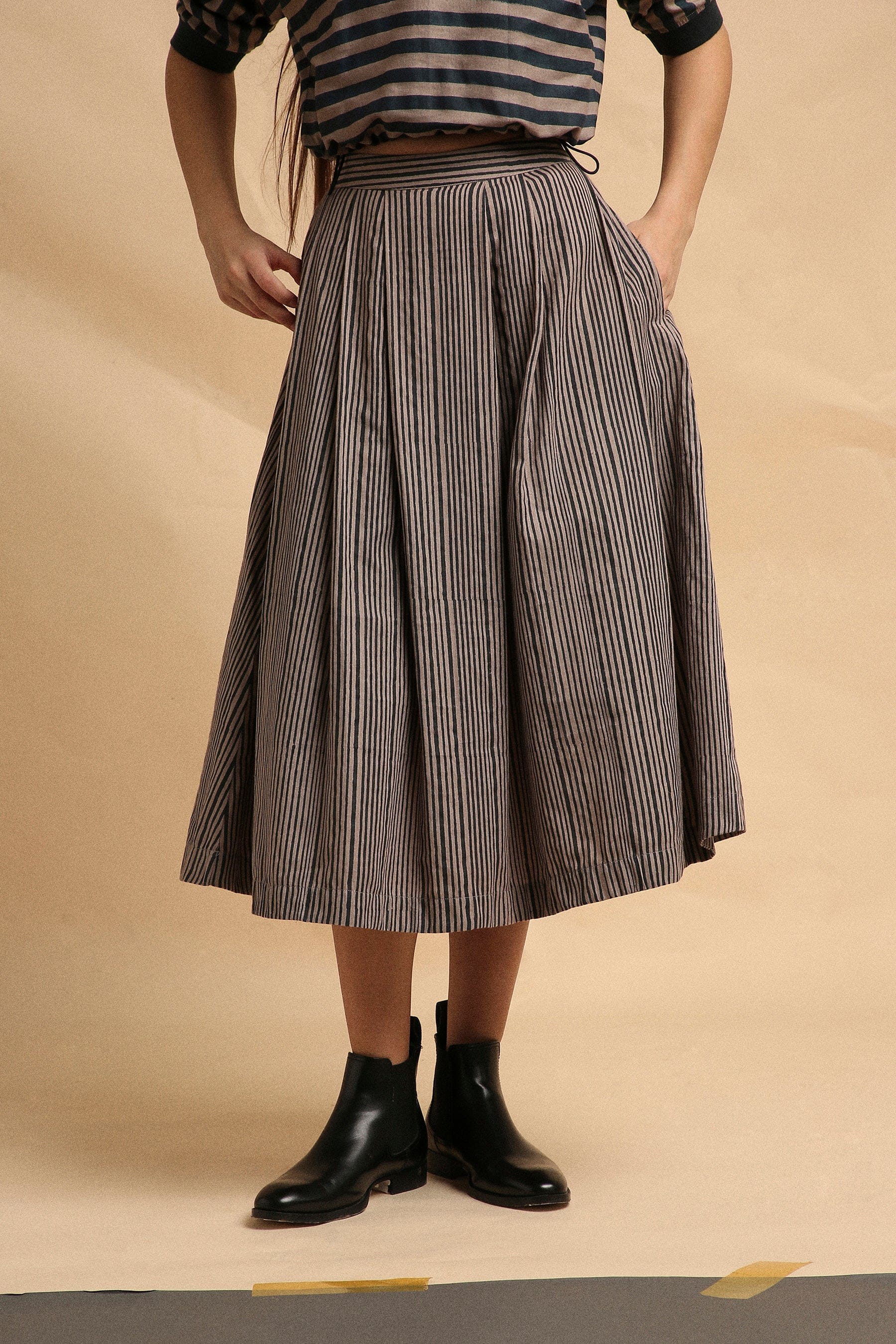 Handspun cotton box pleat skirt in grey with narrow charcoal stripes, back elastic and side zipper, by MATI India