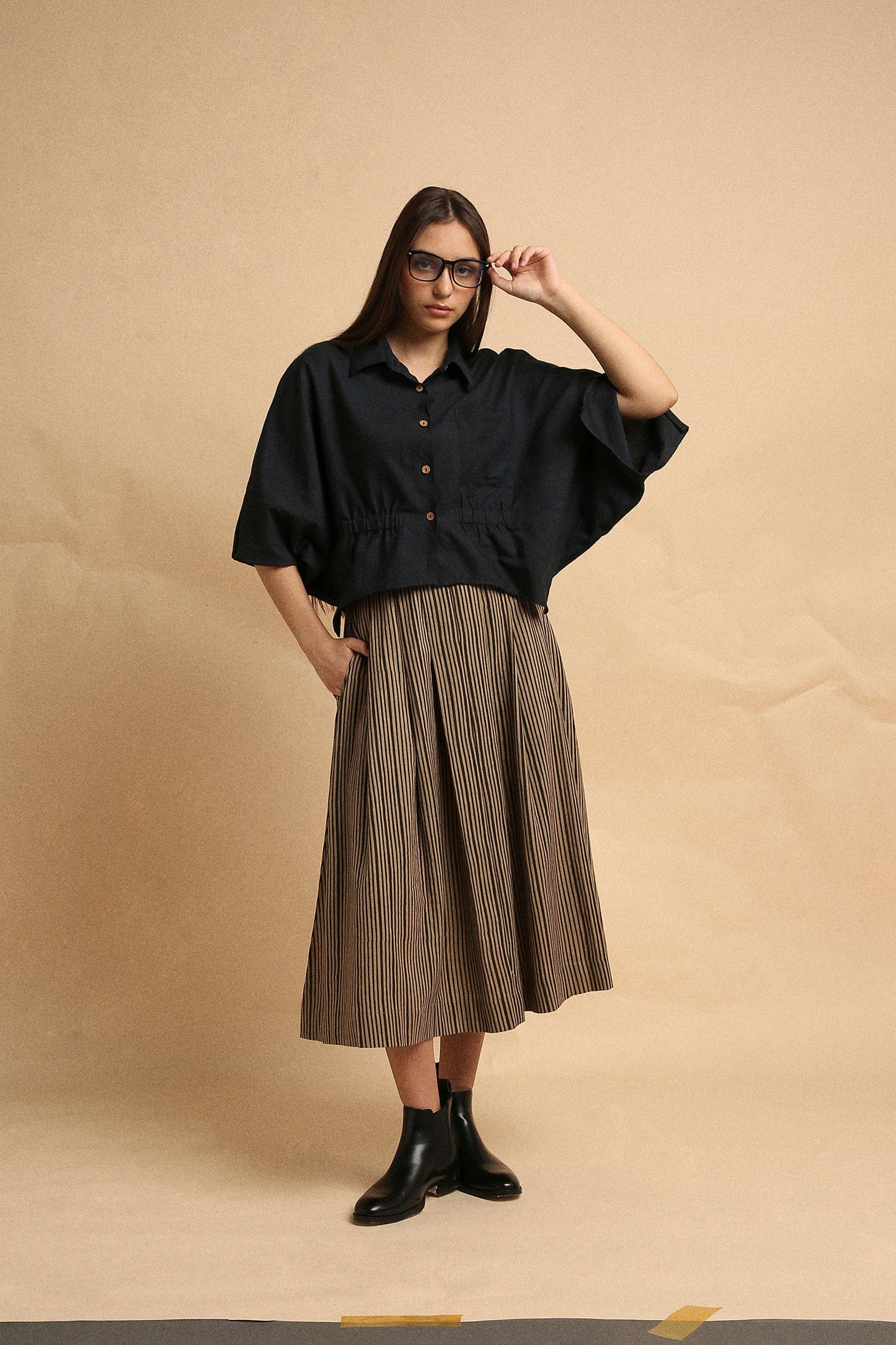 Handspun cotton anti-fit collar crop top in charcoal with front button opening, collar neckline and sleeve slit, by MATI India