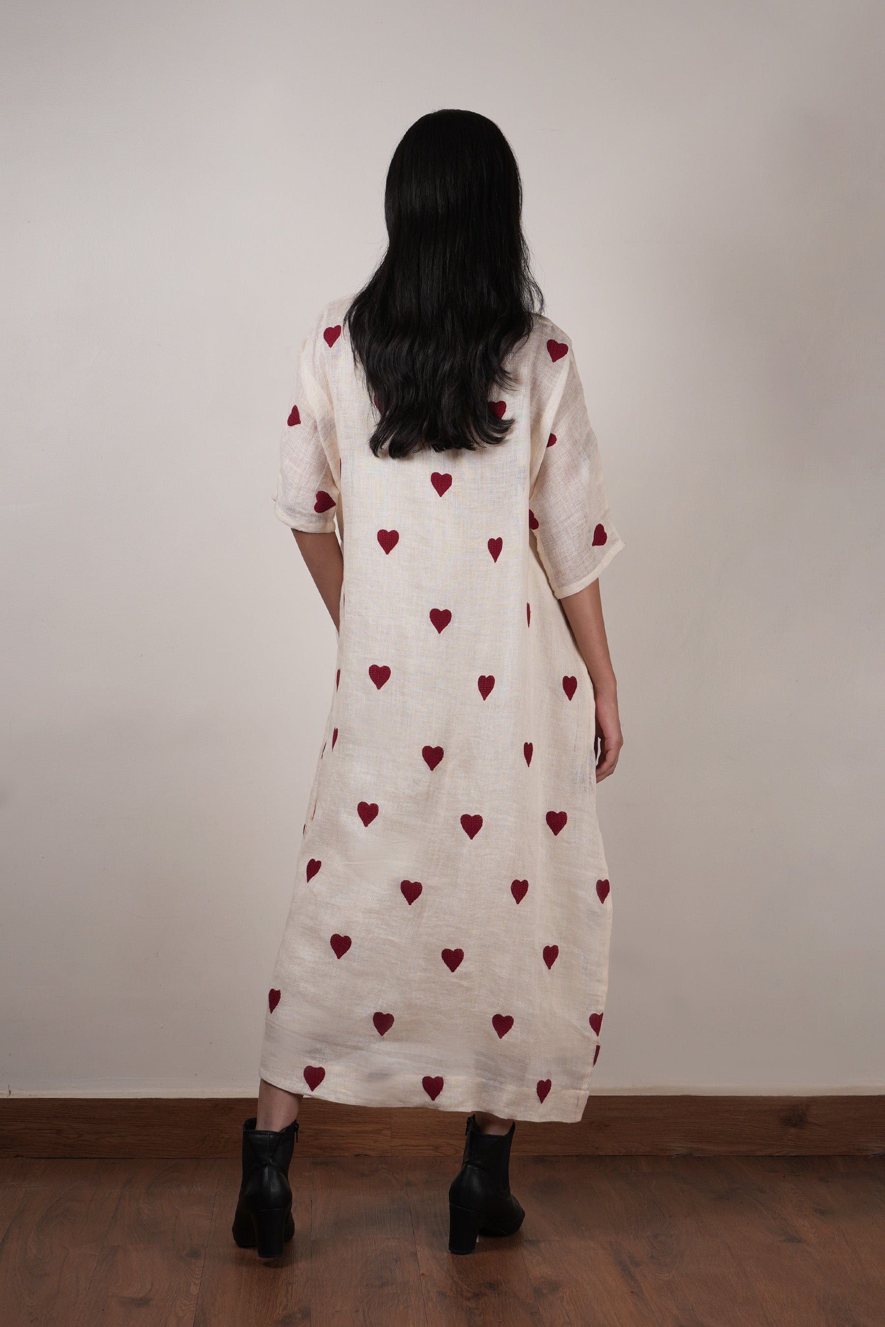Handwoven linen shift dress in oatmeal with heart thread embroidery and extended sleeves, by MATI India