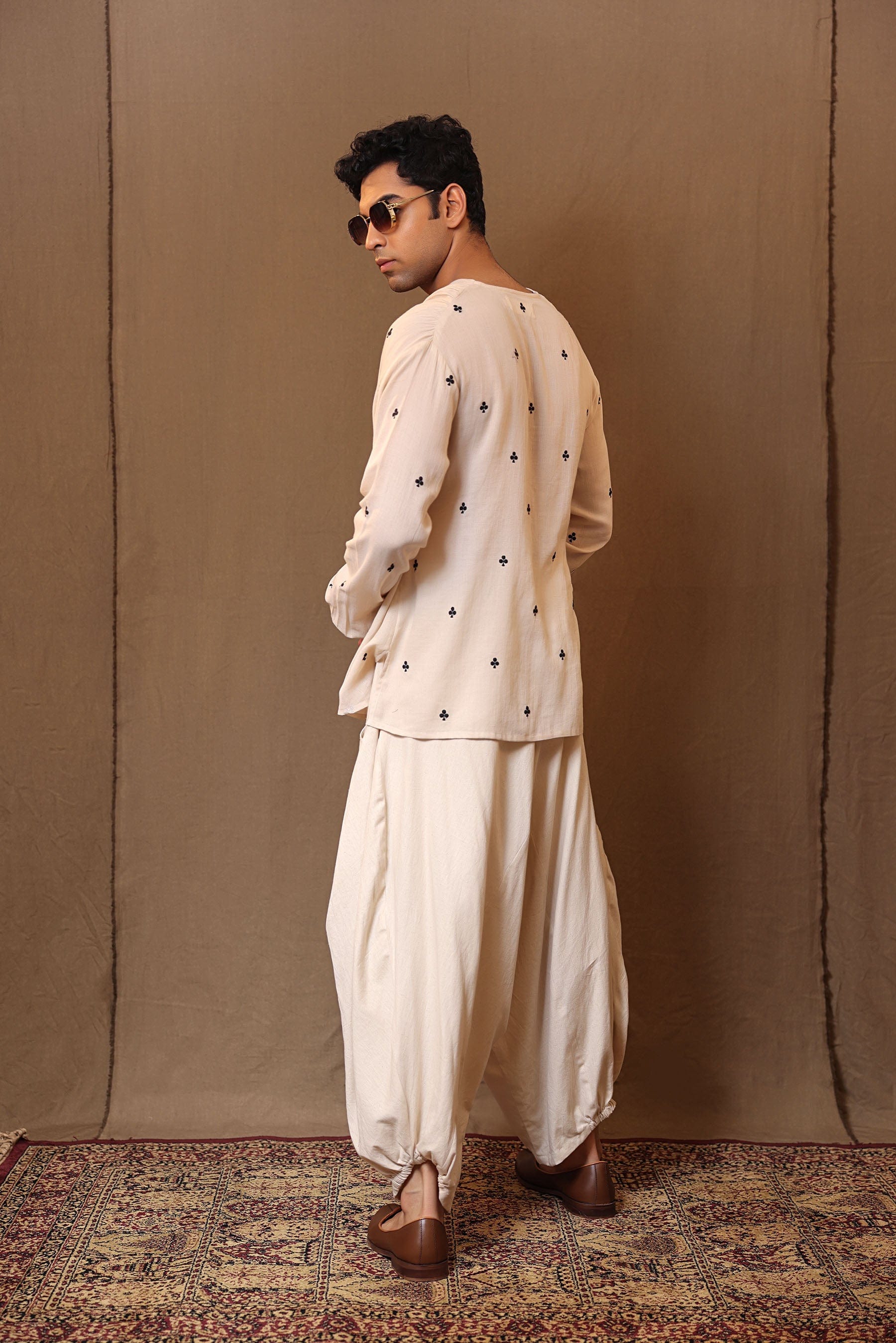 Club motif black embroidery detail on off-white cotton overlap shirt by MATI
