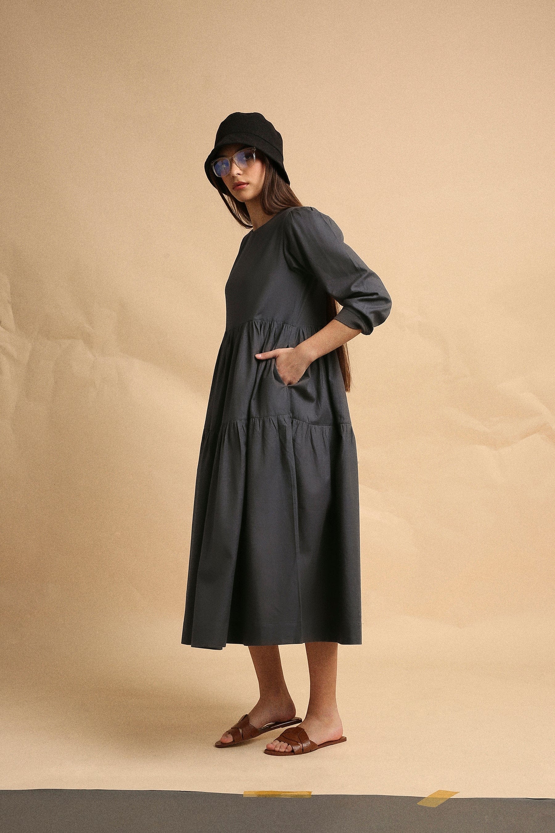 Handspun cotton tiered Vasara rib dress in ash gray with side pockets and wooden button opening, by MATI India