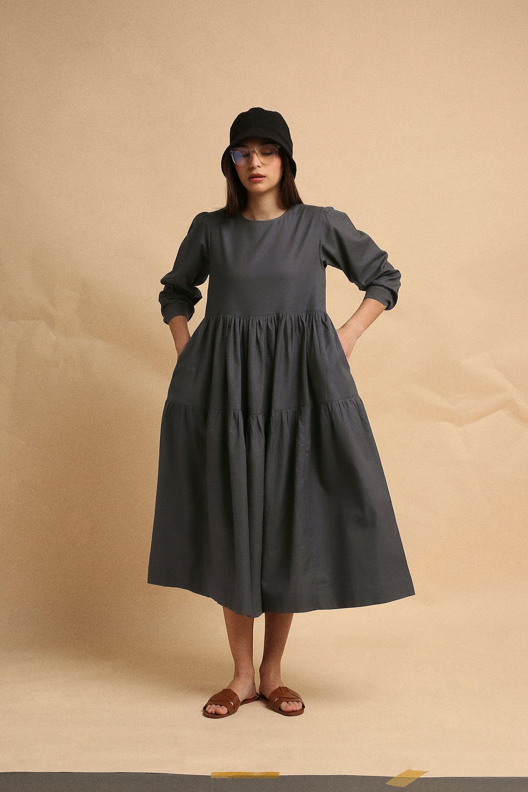 Handspun cotton tiered Vasara rib dress in ash gray with side pockets and wooden button opening, by MATI India