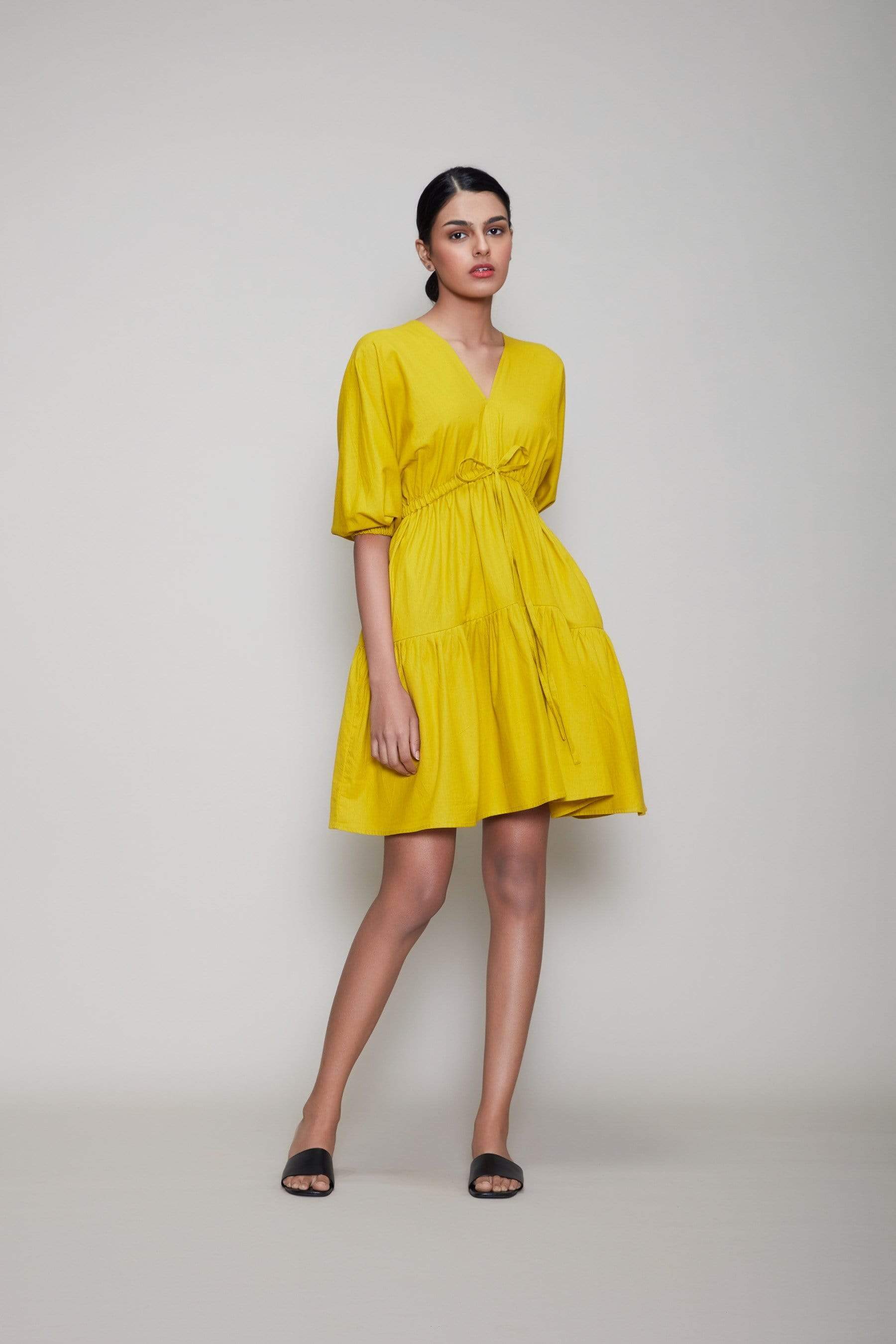 Handwoven cotton short tiered dress in yellow with Azo-free dye, side pockets and drawstring waist, by MATI India